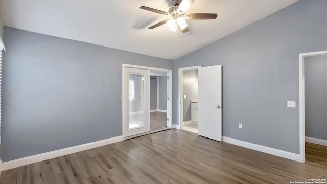 unfurnished bedroom with vaulted ceiling, ceiling fan, and hardwood / wood-style flooring