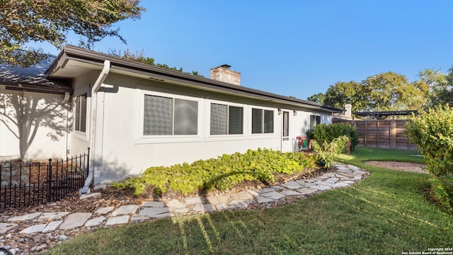 view of property exterior featuring a yard