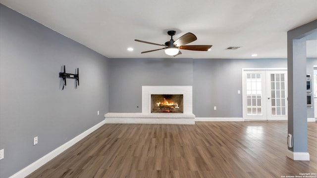 12743 S El Sonteo St, San Antonio, TX 78233 - unfurnished living room featuring ceiling fan, baseboards, wood finished floors, recessed lighting, and a fireplace