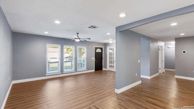 foyer with wood-type flooring and ceiling fan