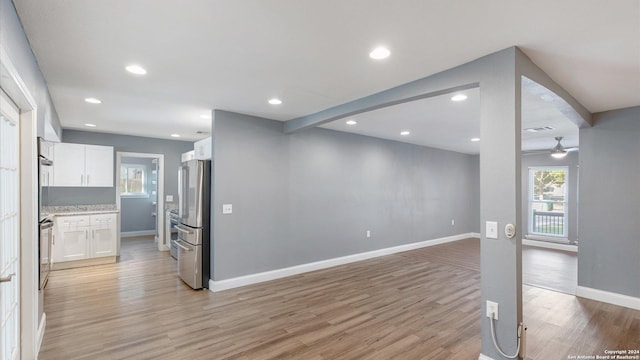 12743 S El Sonteo St, San Antonio, TX 78233 - unfurnished living room featuring light wood-type flooring, baseboards, recessed lighting, and ceiling fan