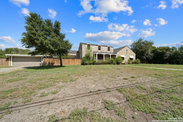 view of front of property with a garage and a front lawn