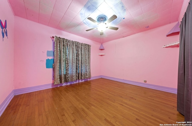 spare room featuring hardwood / wood-style floors and ceiling fan