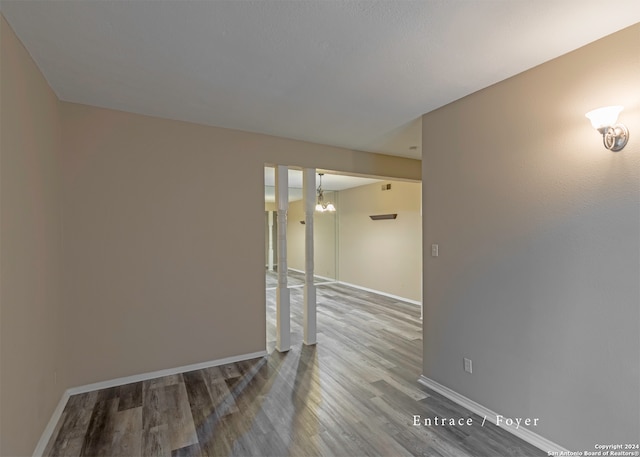 spare room with wood-type flooring