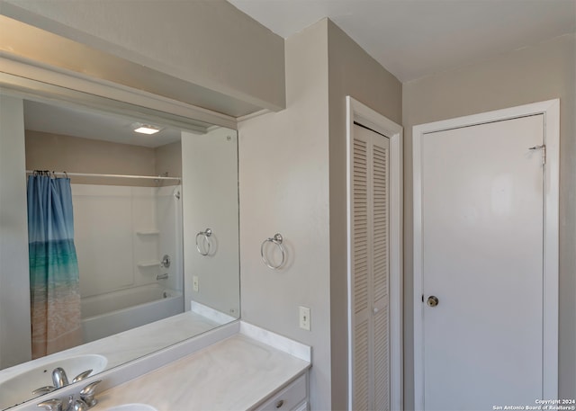 bathroom with shower / tub combo and vanity