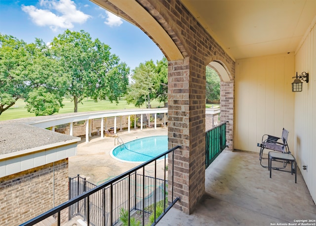 view of swimming pool with a patio area