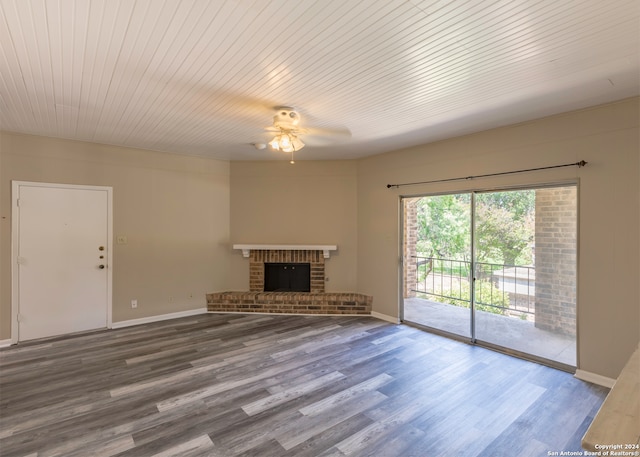 unfurnished living room featuring a fireplace, hardwood / wood-style floors, and ceiling fan