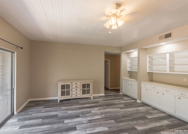 interior space featuring ceiling fan and dark hardwood / wood-style floors