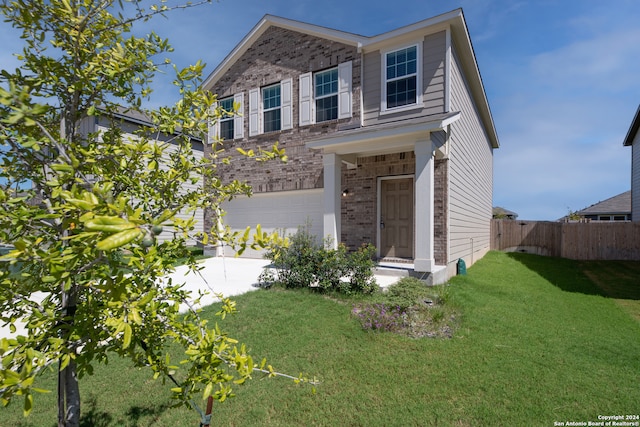 view of front facade with a garage and a front lawn