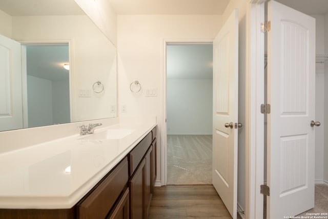 bathroom featuring vanity and hardwood / wood-style floors