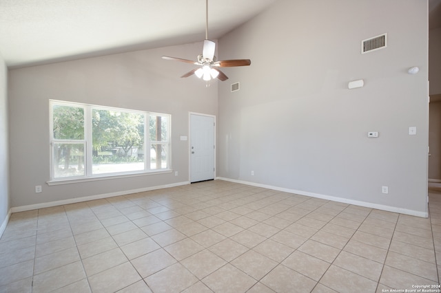 tiled spare room featuring ceiling fan and high vaulted ceiling