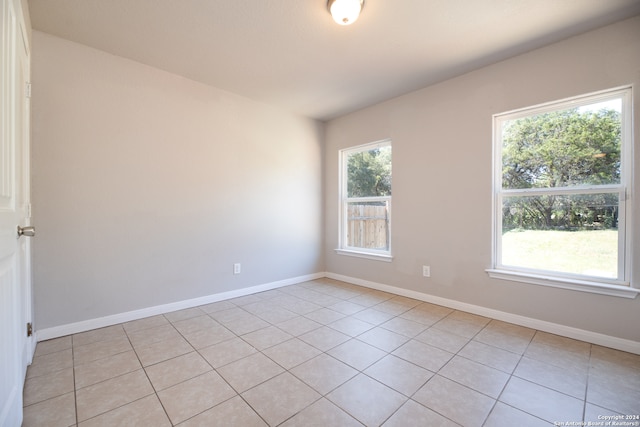 empty room featuring light tile patterned floors