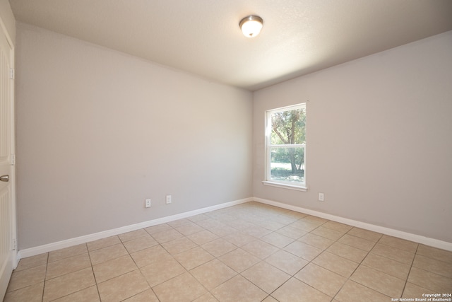 view of tiled spare room