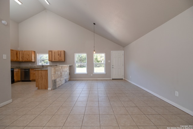 kitchen with dishwasher, kitchen peninsula, high vaulted ceiling, decorative light fixtures, and light tile patterned floors