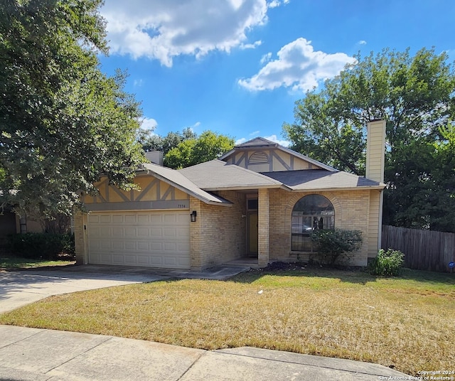 view of front facade with a garage and a front yard