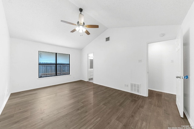 unfurnished room with ceiling fan, dark hardwood / wood-style flooring, a textured ceiling, and high vaulted ceiling