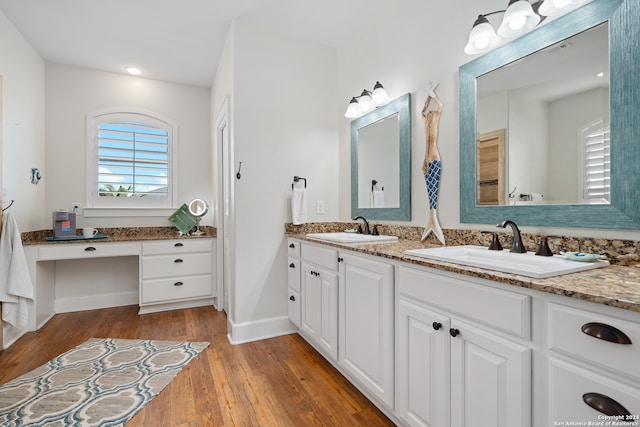 bathroom featuring wood-type flooring and vanity