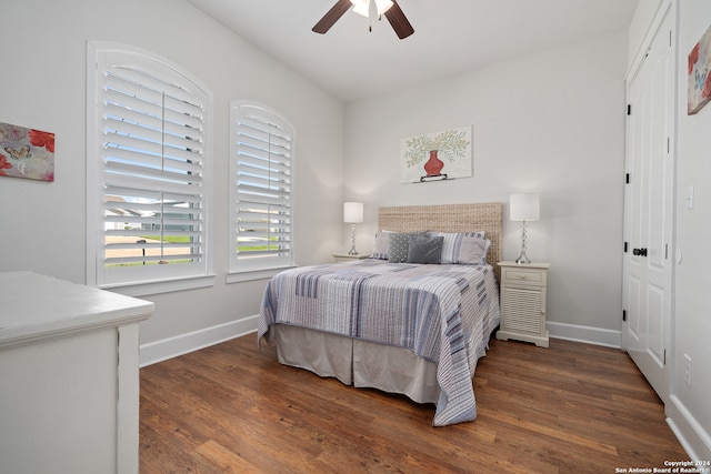 bedroom featuring dark hardwood / wood-style flooring and ceiling fan