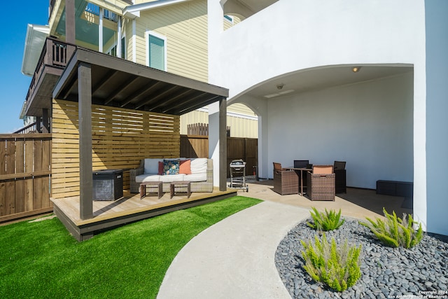 back of property featuring outdoor lounge area, a patio area, and central AC