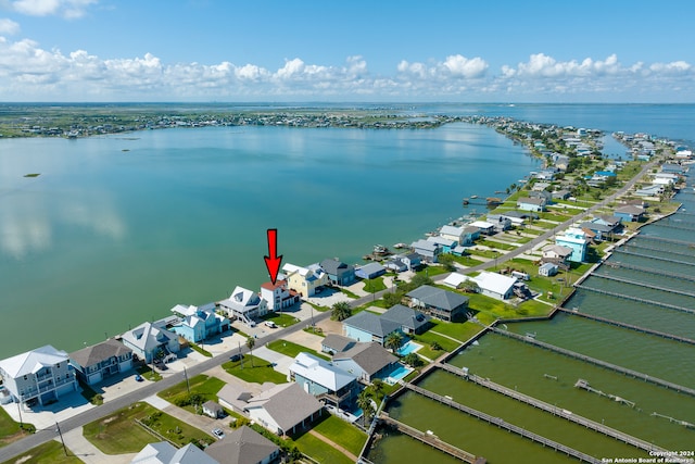 birds eye view of property with a water view