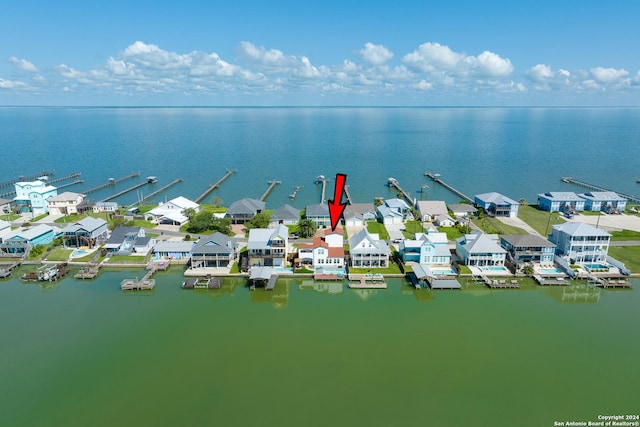 birds eye view of property with a residential view and a water view