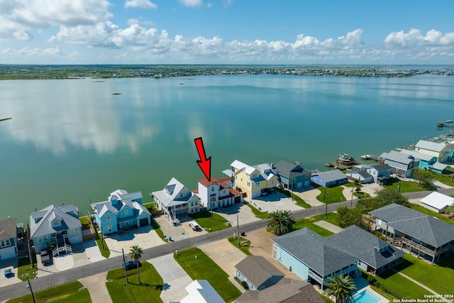 birds eye view of property featuring a residential view and a water view