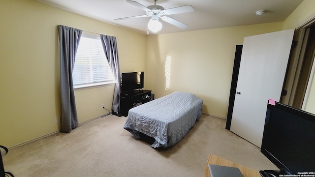 carpeted bedroom featuring ceiling fan