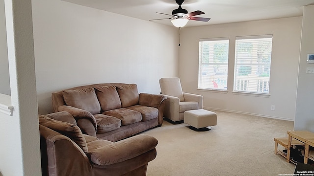 living room featuring ceiling fan and light colored carpet