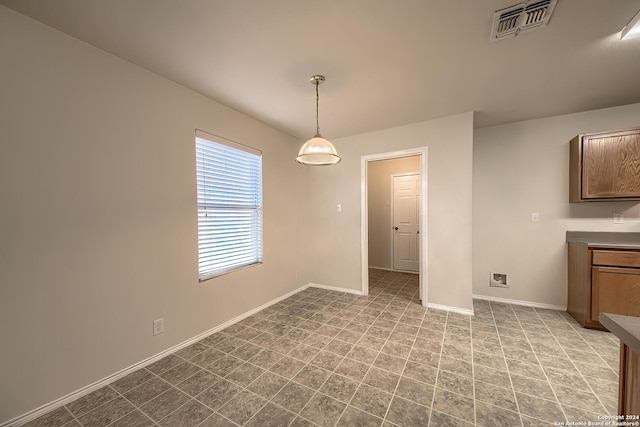 5823 Barton Holw, San Antonio, TX 78249 - unfurnished dining area with baseboards