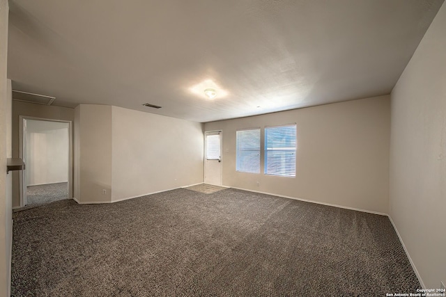 5823 Barton Holw, San Antonio, TX 78249 - spare room featuring dark colored carpet and baseboards