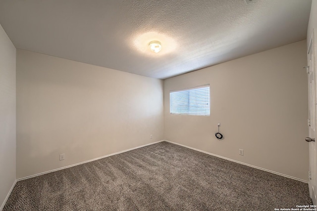 5823 Barton Holw, San Antonio, TX 78249 - carpeted empty room with baseboards and a textured ceiling