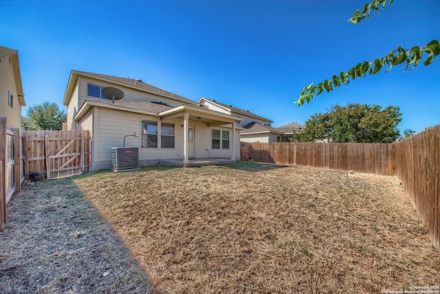 5823 Barton Holw, San Antonio, TX 78249 - rear view of property featuring a patio, a fenced backyard, central air condition unit, and a gate