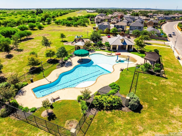 view of pool with a lawn and a patio