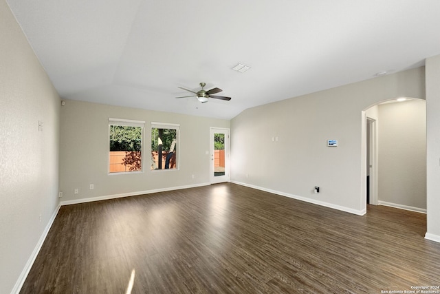 unfurnished room featuring lofted ceiling, dark hardwood / wood-style floors, and ceiling fan