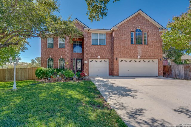 3303 Cambria Way, San Antonio, TX 78251 - view of front of property featuring a garage, fence, driveway, and a front yard