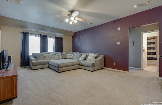 carpeted living room with ceiling fan