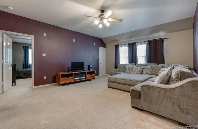 3303 Cambria Way, San Antonio, TX 78251 - living area featuring light colored carpet, vaulted ceiling, ceiling fan, baseboards, and visible vents