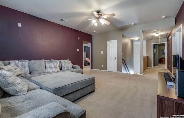 carpeted living room featuring ceiling fan