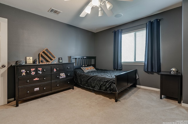 carpeted bedroom with ceiling fan