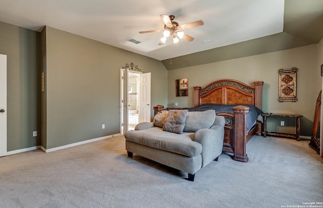 bedroom featuring vaulted ceiling, light carpet, ceiling fan, and ensuite bathroom