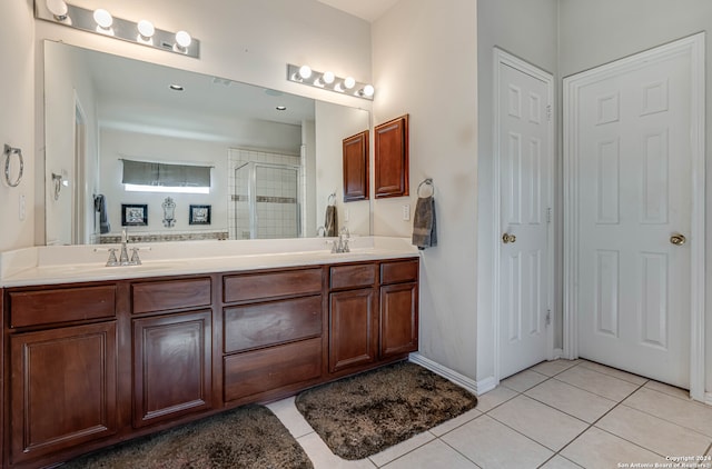 bathroom with vanity, tile patterned flooring, and an enclosed shower