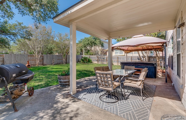 view of patio / terrace with a gazebo and a hot tub