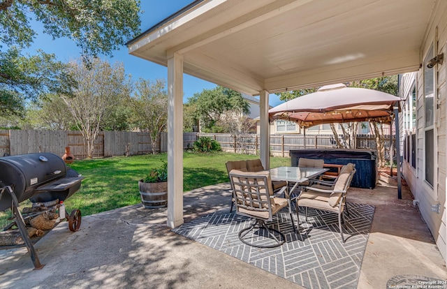 3303 Cambria Way, San Antonio, TX 78251 - view of patio with a gazebo, outdoor dining area, a hot tub, and a fenced backyard