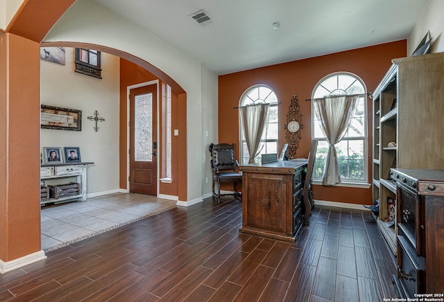 home office with dark wood-type flooring