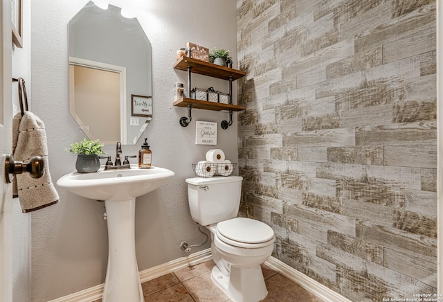 3303 Cambria Way, San Antonio, TX 78251 - bathroom with tile patterned floors, baseboards, and toilet