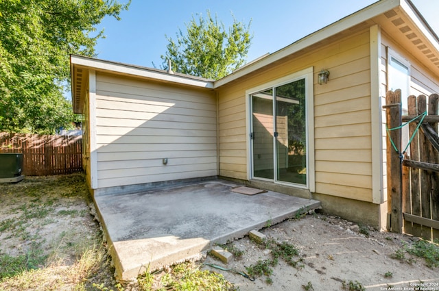 rear view of house featuring a patio area and fence