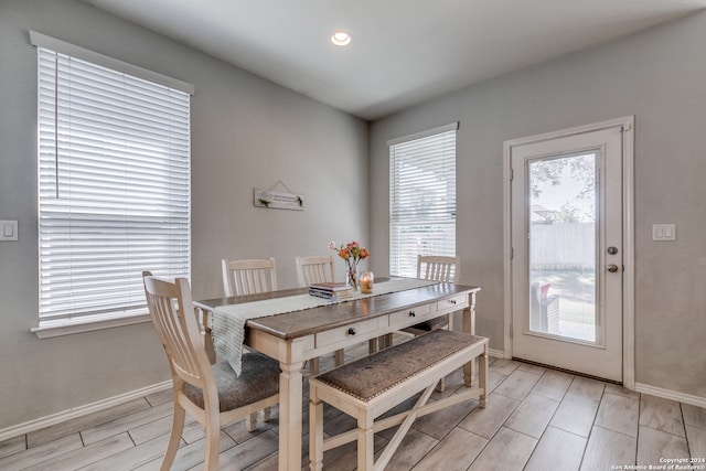 dining space with light hardwood / wood-style flooring