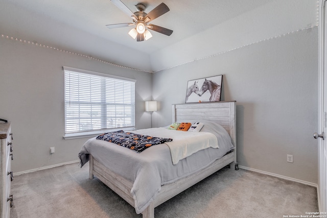 bedroom with ceiling fan and light colored carpet