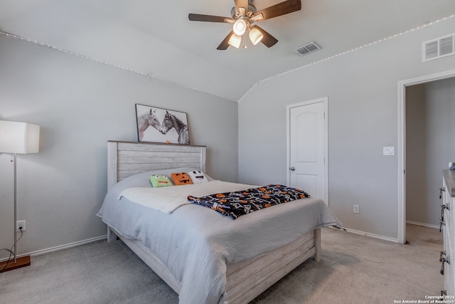 carpeted bedroom with ceiling fan and lofted ceiling