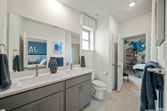 bathroom with vanity and toilet